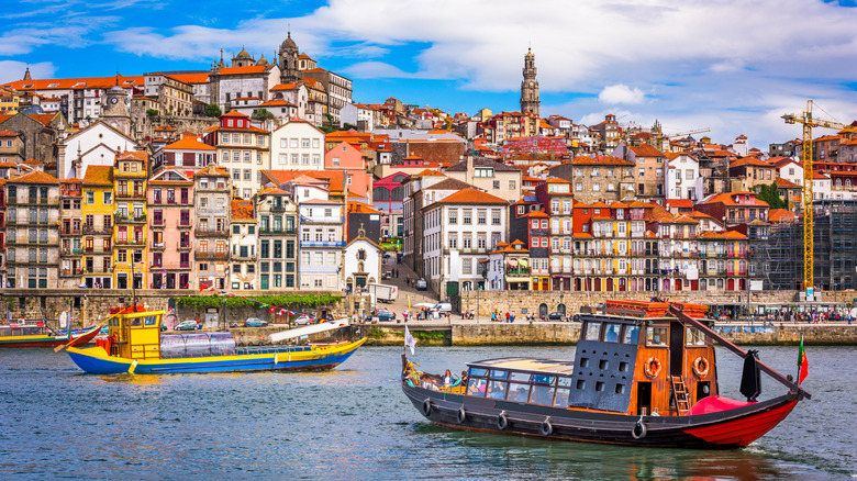 Porto skyline, red-tiled roof houses, riverside, wooden boats floating