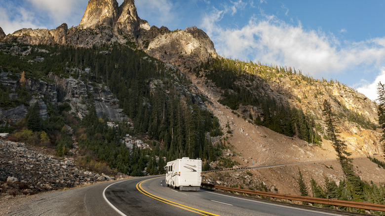 An RV drives by Liberty Bell Mountain on the North Cascades Highway in Washington
