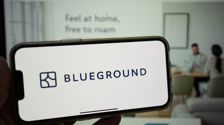 The Blueground platform on an iPhone and laptop