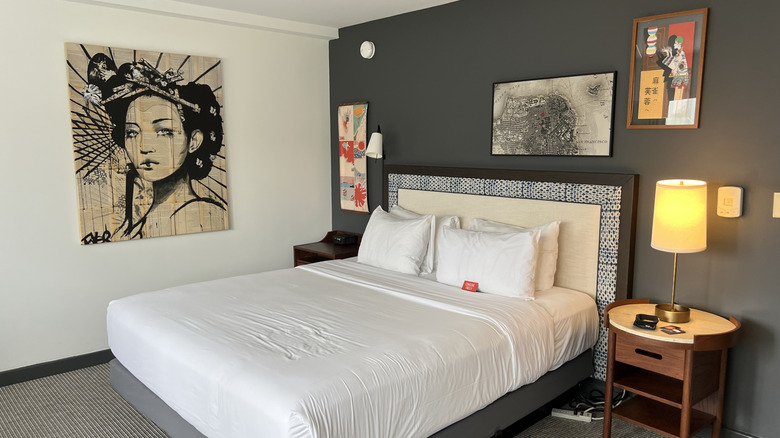 Hotel room with lots of wall art displayed on the walls