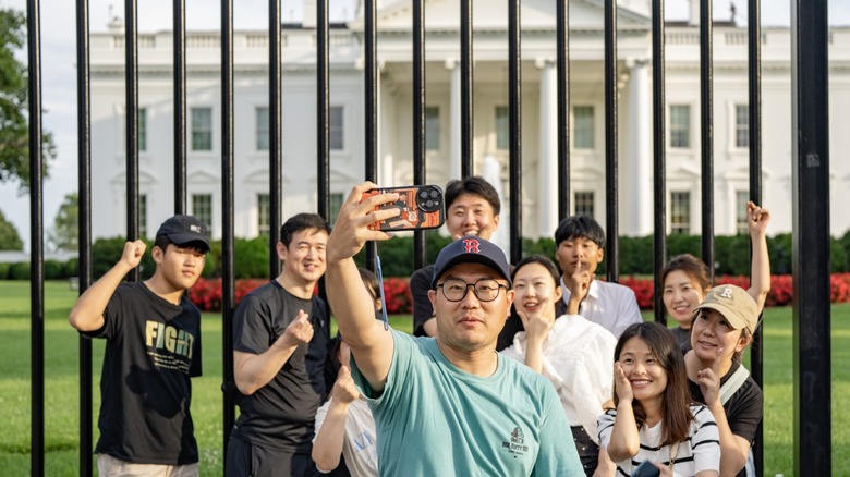 Tourists taking a selfie at the White House