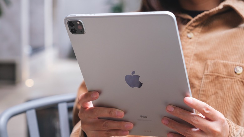 A person holding an iPad