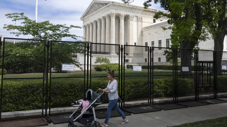 Someone pushing a stroller near the White House