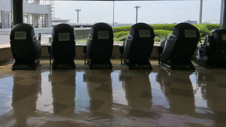 Line of massage chairs at Narita Airport in Tokyo, Japan