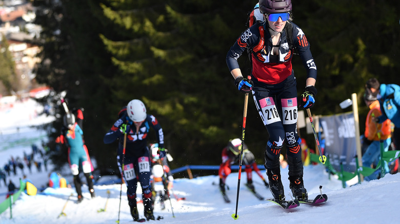 ski mountaineering athletes compete uphill