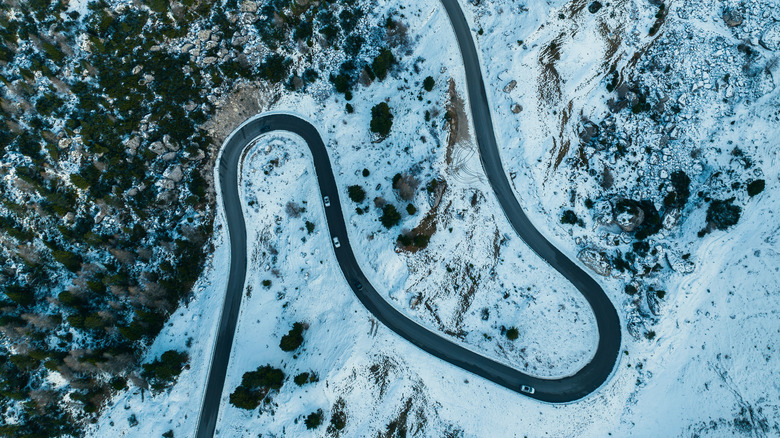 birds-eye view of a mountain road in the italian dolomites