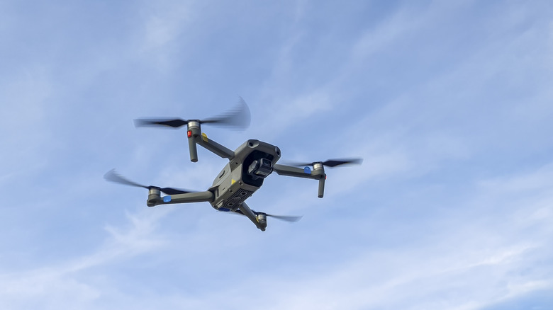 Photo of small photography drone in the sky