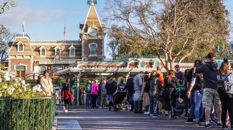 People waiting in line to enter Disneyland main gate