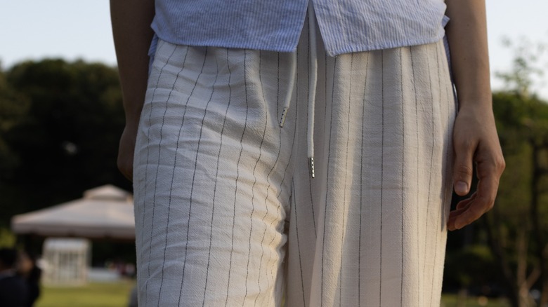 A woman wearing breezy pants