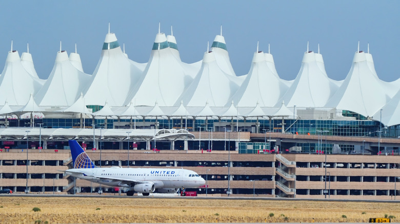 A United plane parked on a runway at Denver International Airport (DEN) in Colorado