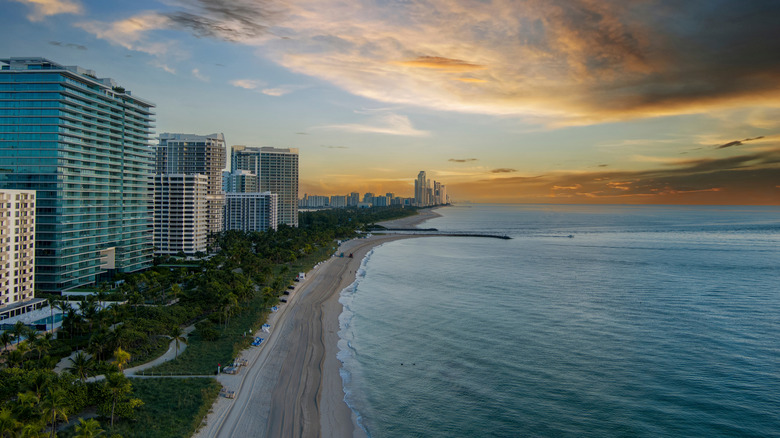 Aerial view of the beach and high-rise buildings in Miami Beach at sunrise