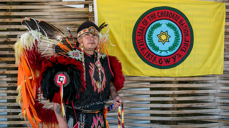 A Native American poses for pictures along the highway on May 11, 2018 in Cherokee, North Carolina