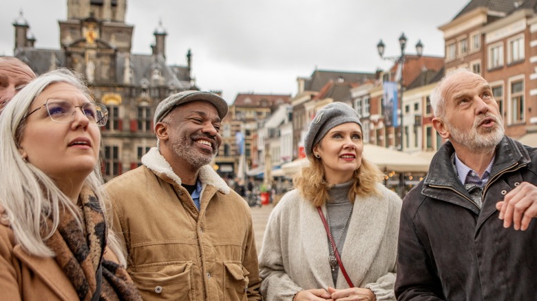 A group of travelers looking at European architecture