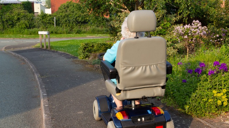 A woman riding an electric cart