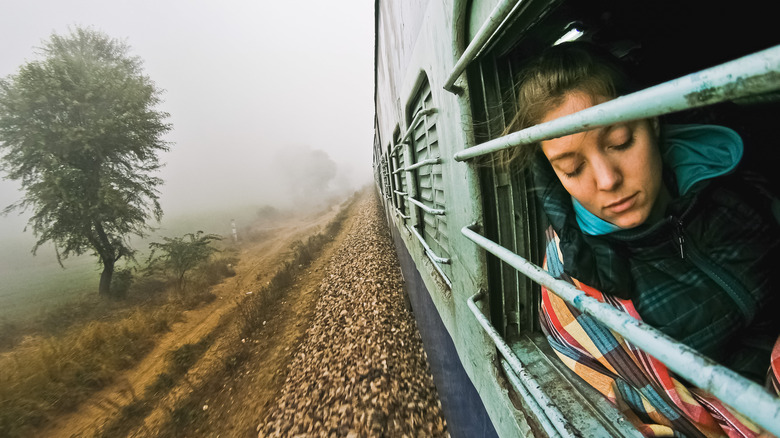 Young woman traveling on an Indian train.