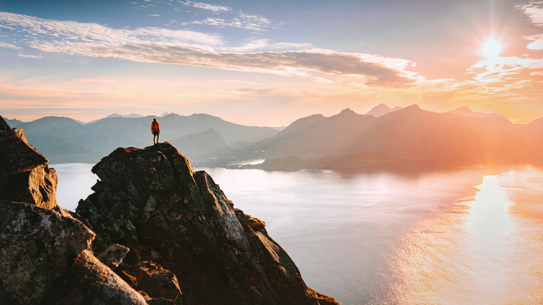 A solo hiker in Norway admiring the view.