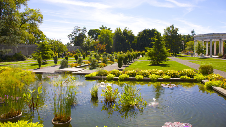 Grasses in pool and rows of perennial beds and fountains at Untermyer Park and Gardens, Yonkers, New York