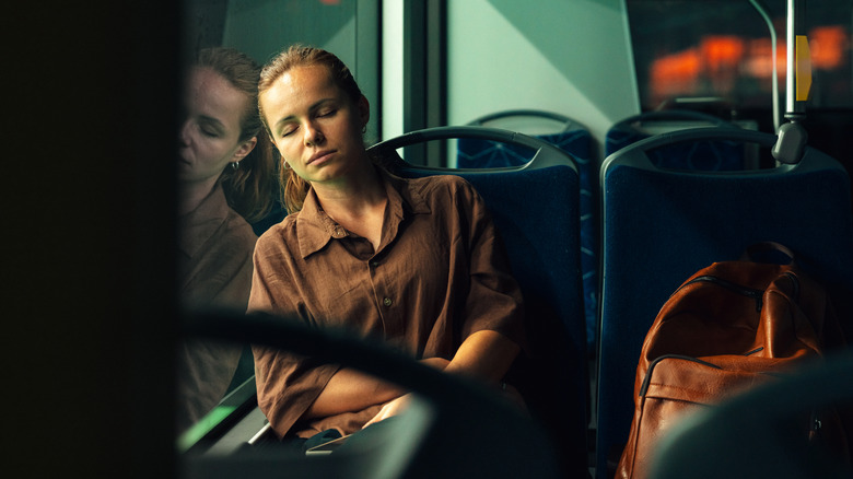 Person sleeping on bus
