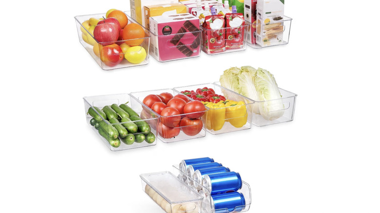 View of 10-piece acrylic food and storage organizer bins filled with produce and other items on a white background