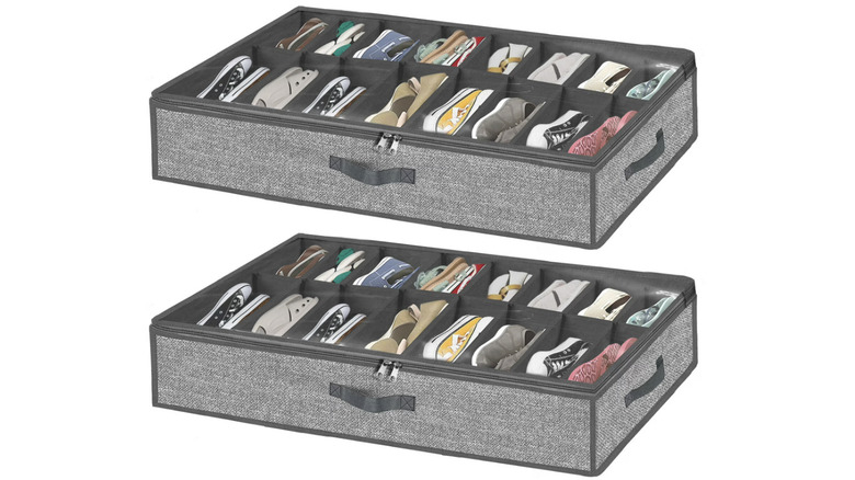 Two gray underbed shoe storage containers with clear tops and zipper closures on white background