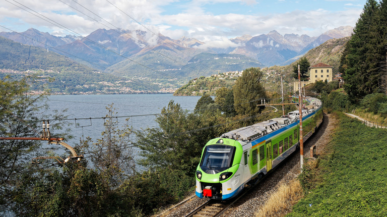 Train driving by Lake Como in northern Italy
