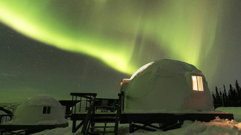 A geodome in Borealis Basecamp with the Northern Lights