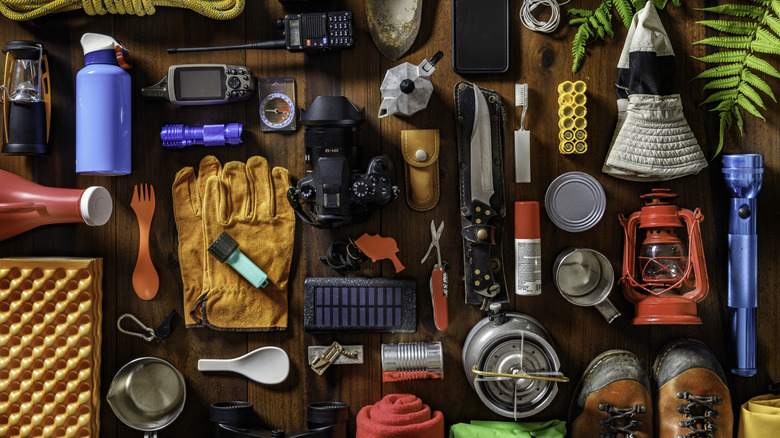 Top view of large group of gear, equipment, and accessories for mountain trips
