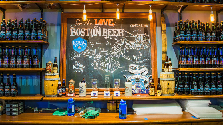 Interior of Samuel Adams Brewery in Boston showing a faux chalkboard and many bottles of beer