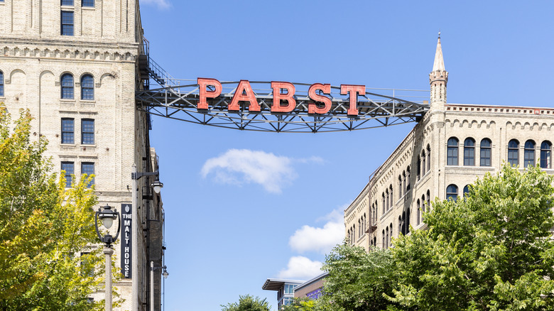 Sign hanging between two buildings outside the former Pabst Brewery in Milwaukee