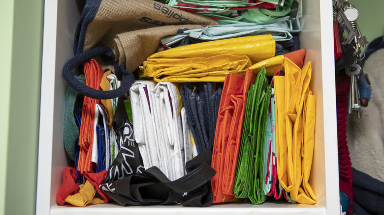 Reusable tote bags folded in a box