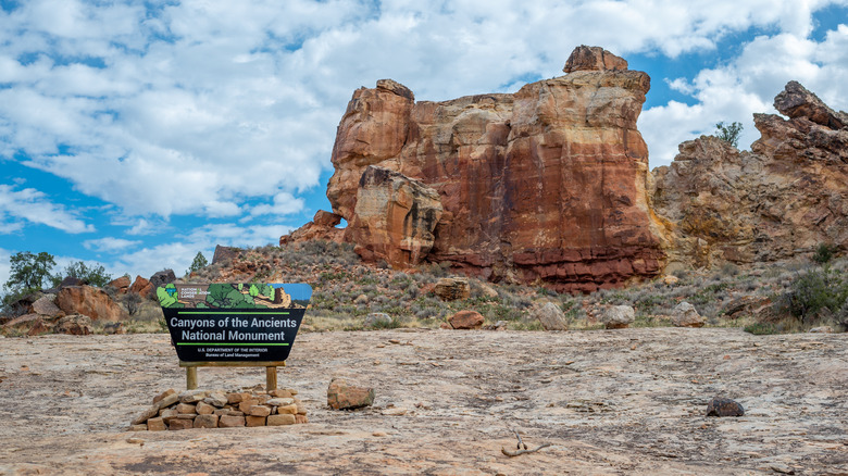 Canyons of the Ancients National Monument entrance sign near Sand Canyon in front of Castle Rock