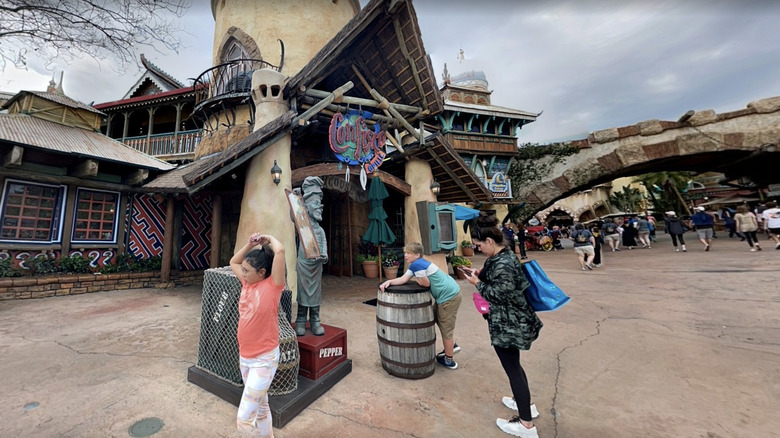 People standing outside of Confisco Grille at Universal Islands of Adventure theme park.