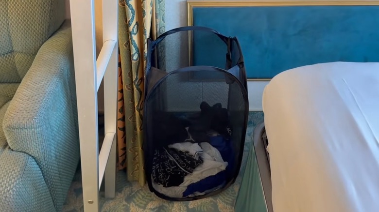 Pop up hamper in cruise cabin