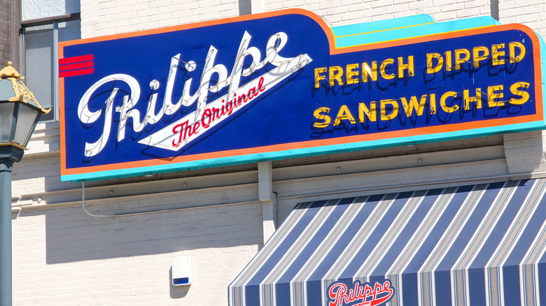 The blue and white exterior sign on the wall outside Philippe The Original