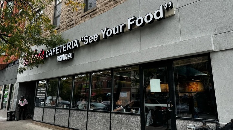 The exterior of Valois with a sign above a row of windows
