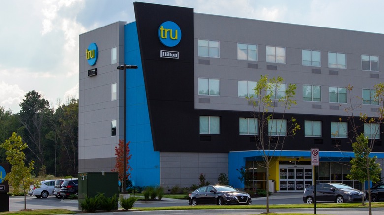 The exterior front and signage of a Tru hotel
