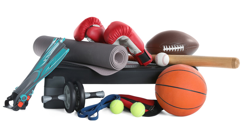 Stack of athletic equipment on white background
