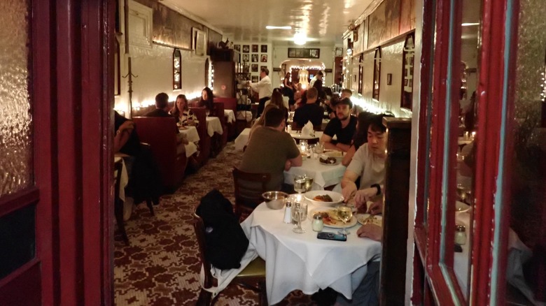 People eating inside John's of 12th Street