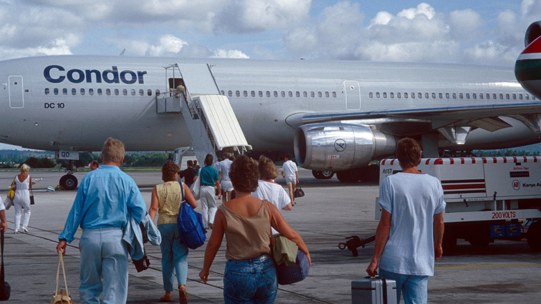 Passengers boarding a charter plane at Nairobi airport in 1982