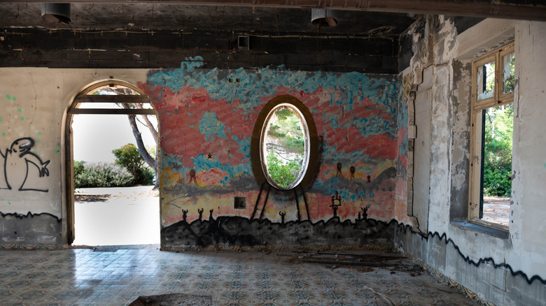 Deteriorated walls and looking out to exterior of abandoned hotel in Croatia's Kupari Resort area