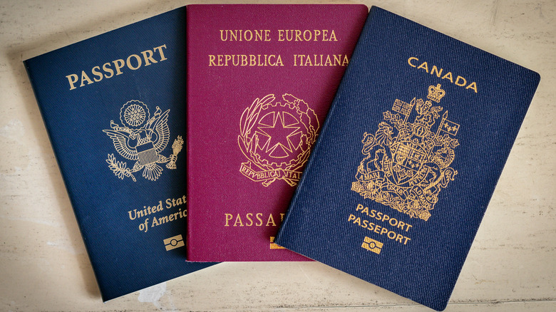 A passport each from the United States, Italy, and Canada