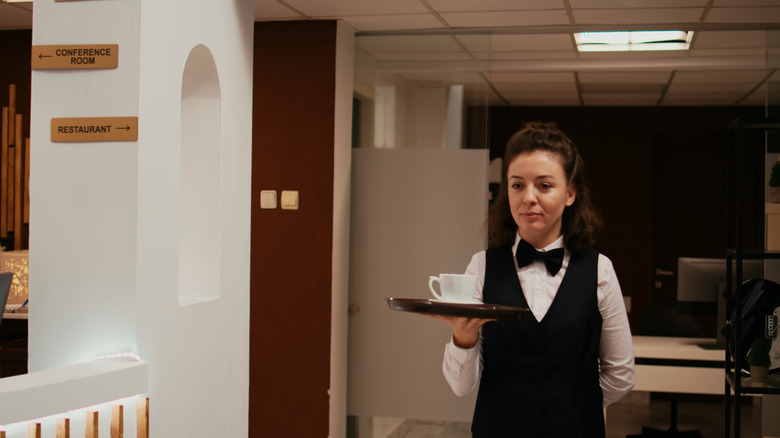 A waitress serving coffee