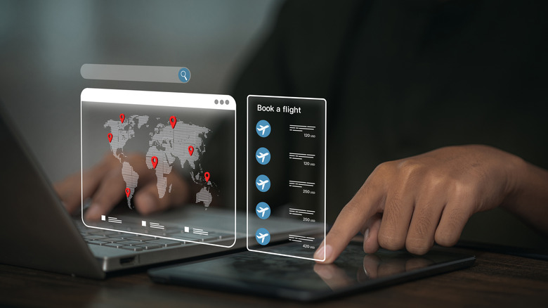Holographic world map, price list next to man's fingers tapping on a tablet