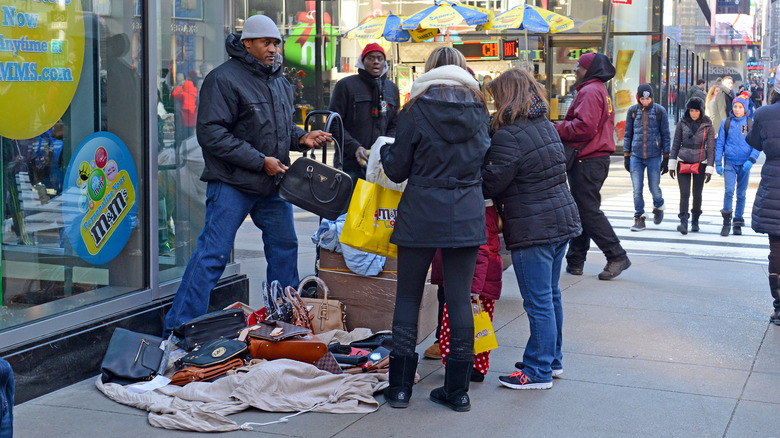 Man selling fake purses