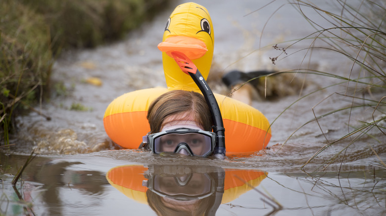 Bog snorkeler with inflatable duck