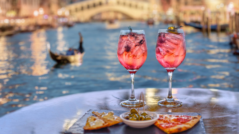 Cicchetti and wine beside a canal in Venice