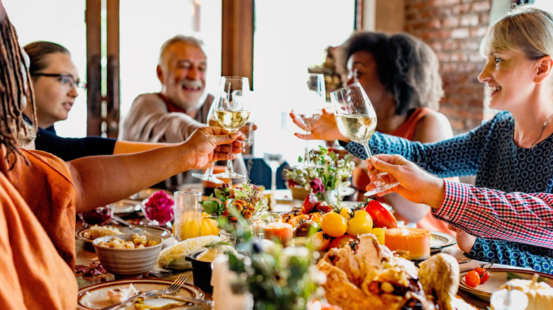 Group of people sharing a meal around a table