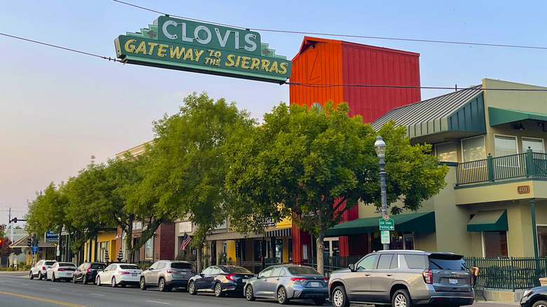 Downtown Clovis with a sign reading "Clovis Gateway to the Sierras" above the main street