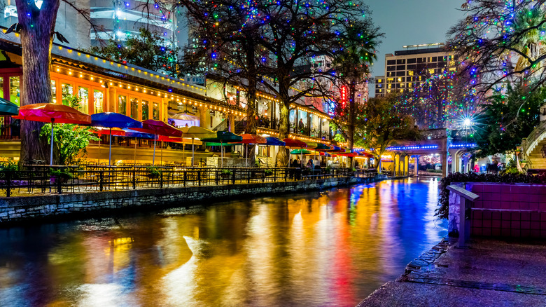 Christmas lights on trees and buildings along the San Antonio River Walk