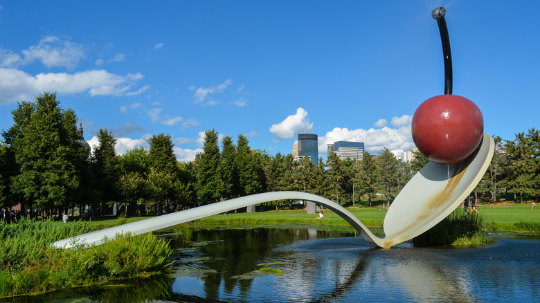 Spoonbridge and Cherry at Walker Art Center with downtown Minneapolis in background